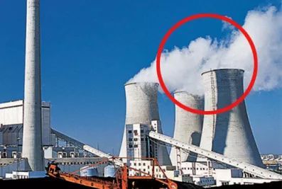 What is the cause of the white smoke from the cooling tower