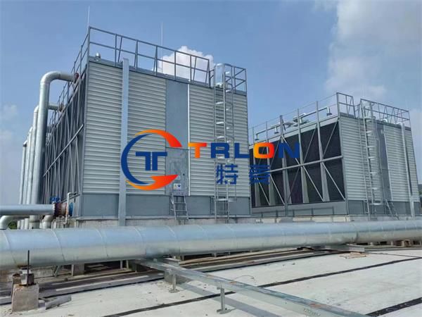 Which components affect the service life of a closed-loop cooling tower?